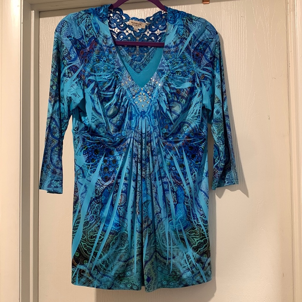 Ladies blue top v-neck with designs on neck